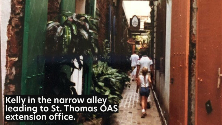 Kelly in the narrow alley leading to the St. Thomas OAS extension office