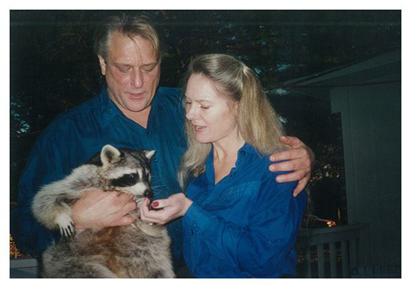 Mark & Cathy with pet raccoon